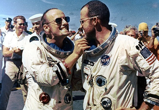 Charles Conrad and Gordon Cooper after landing Gemini 5, wearing aviator sunglasses